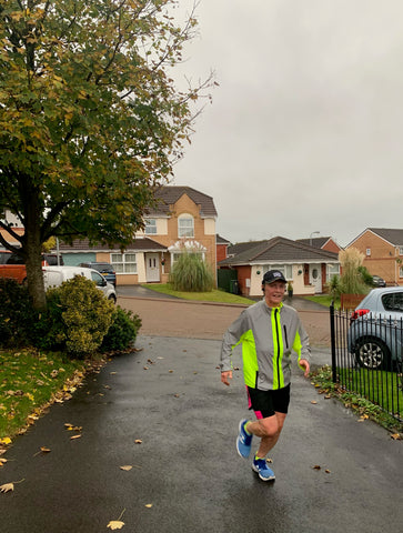 BTR reflective cycling and running high visibility jacket being worn by a man running