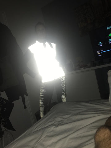 BTR reflective running high vis gilet being worn by a lady demonstrating how high viz it is at night for women