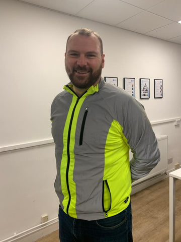 BTR jacket in high vis yellow & reflective panels worn by a cyclist, customer photo 