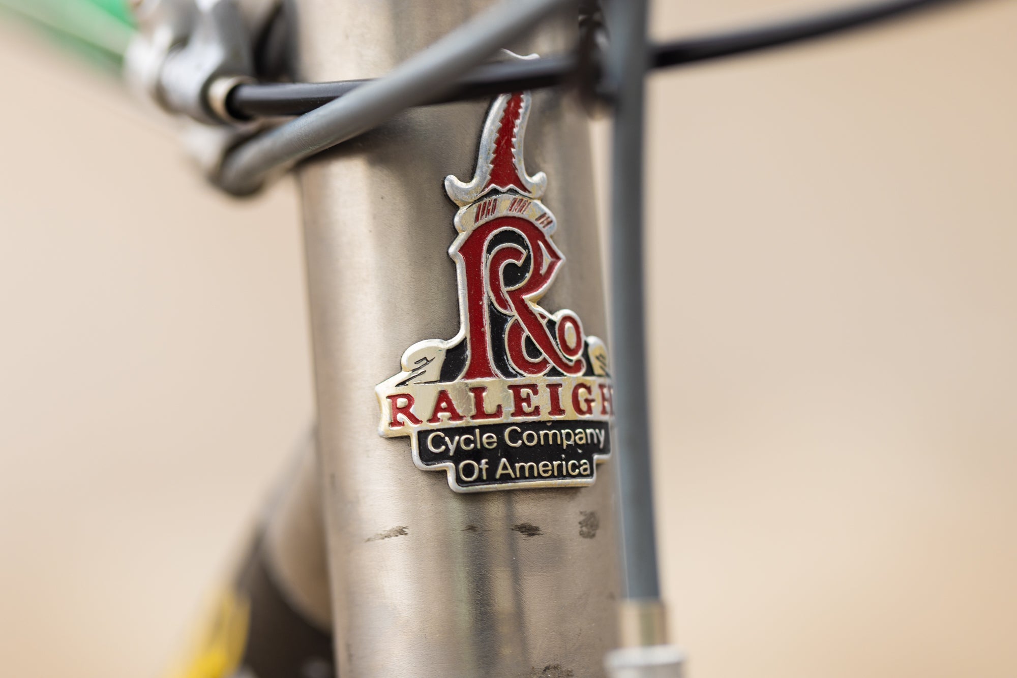 John Tomac Raleigh Signature headbadge