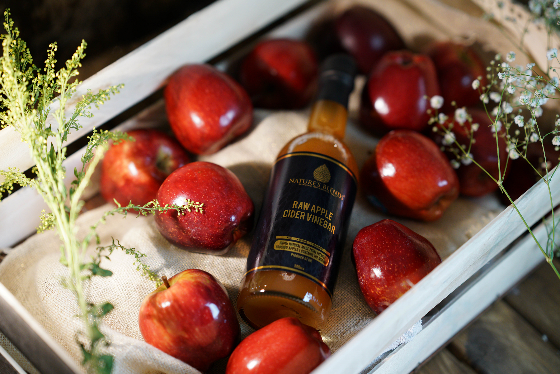 a basket of apple and natures blends organic apple cider vinegar