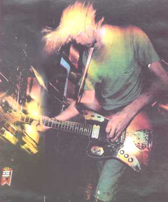 kurt cobain nirvana lead singer playing his fender jaguar road worn guitar