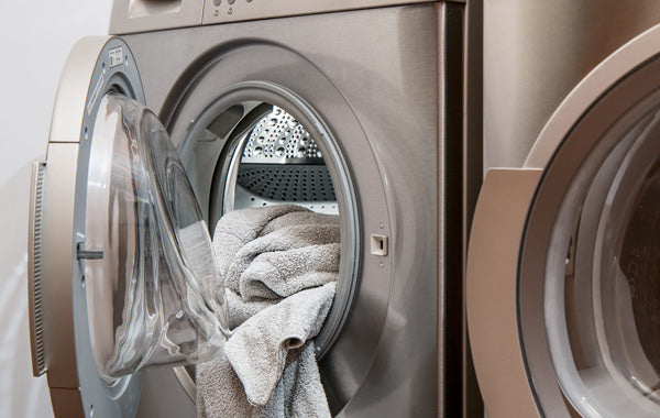 washing machine and gray towel