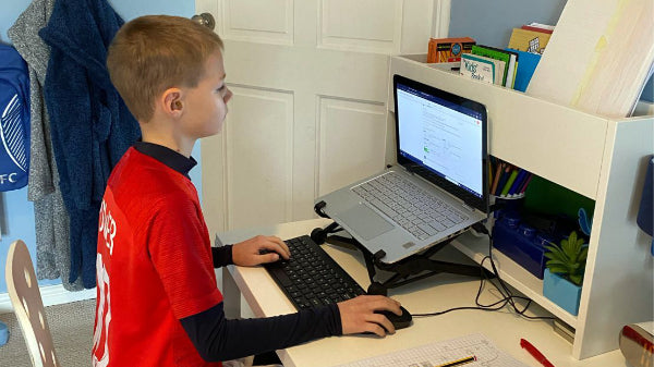 Child using Nexstand laptop stand