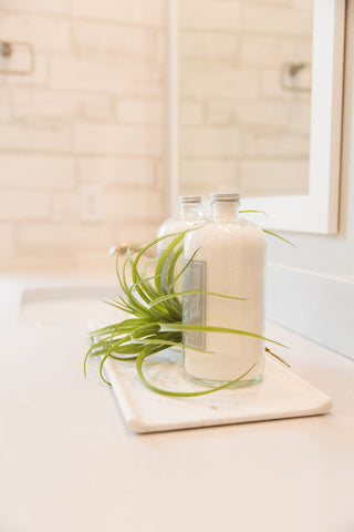 soap on a tray in a bathroom by pure and coco