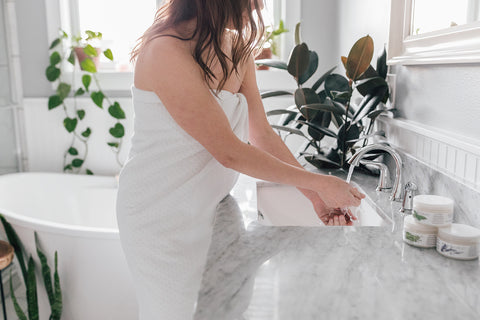 Woman washing her hands with water