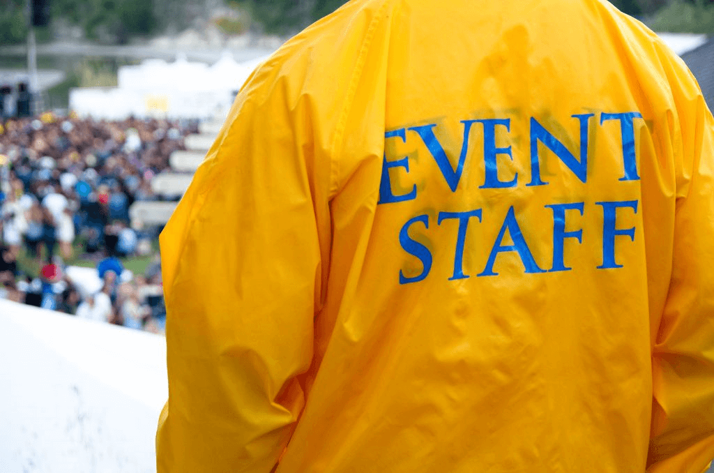 Event staff standing in front of a crowd