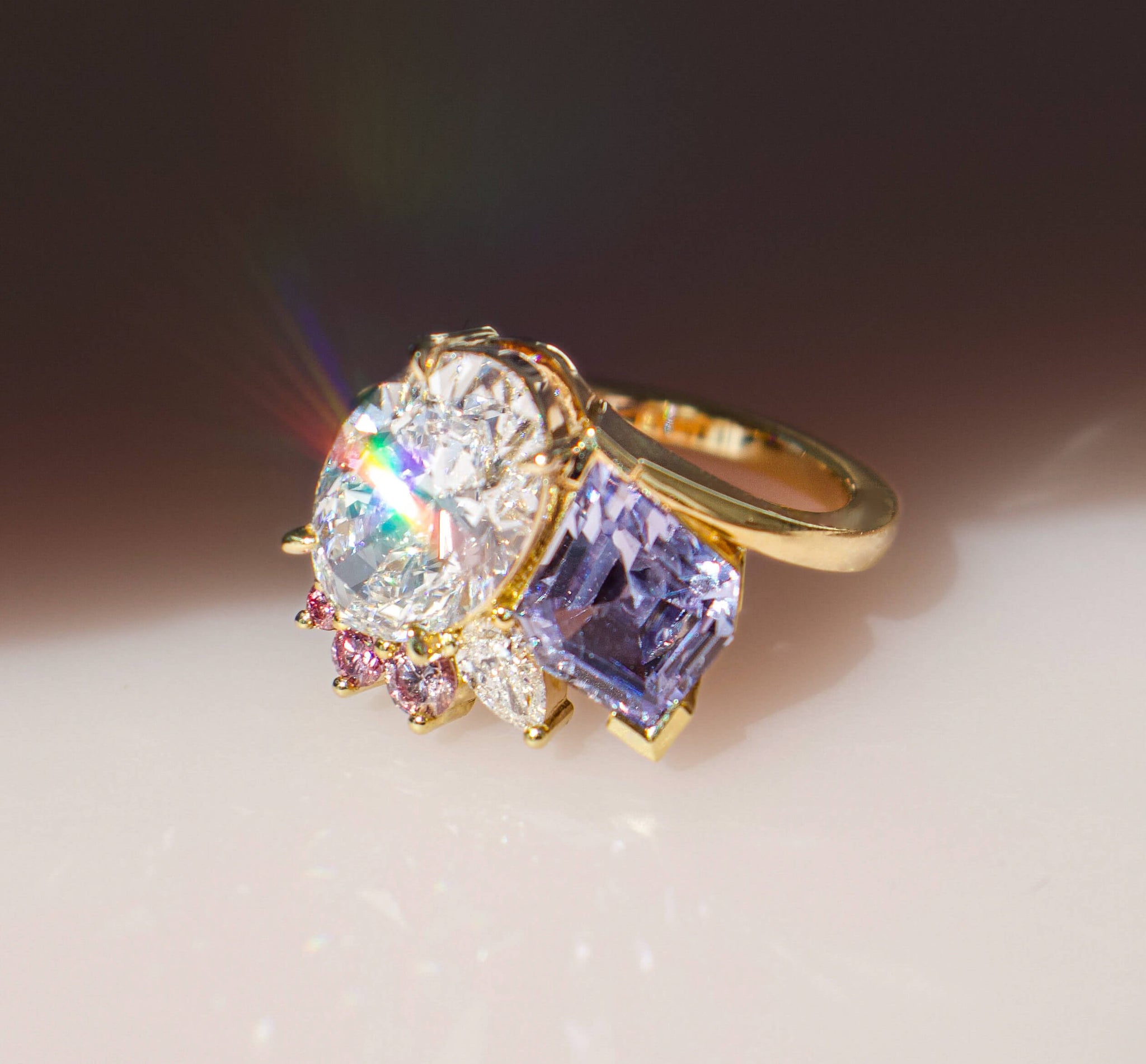 Toi et moi diamond and sapphire ring featuring round pink diamond accents and a 2.01ct oval cut Type 2A white diamonds