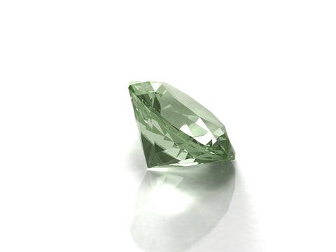 Peridot Stone placed on a white surface.