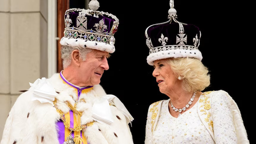 King Charles III and Queen Camilla engaged in a conversation