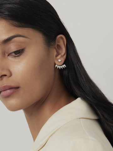 A model wearing diamond earrings