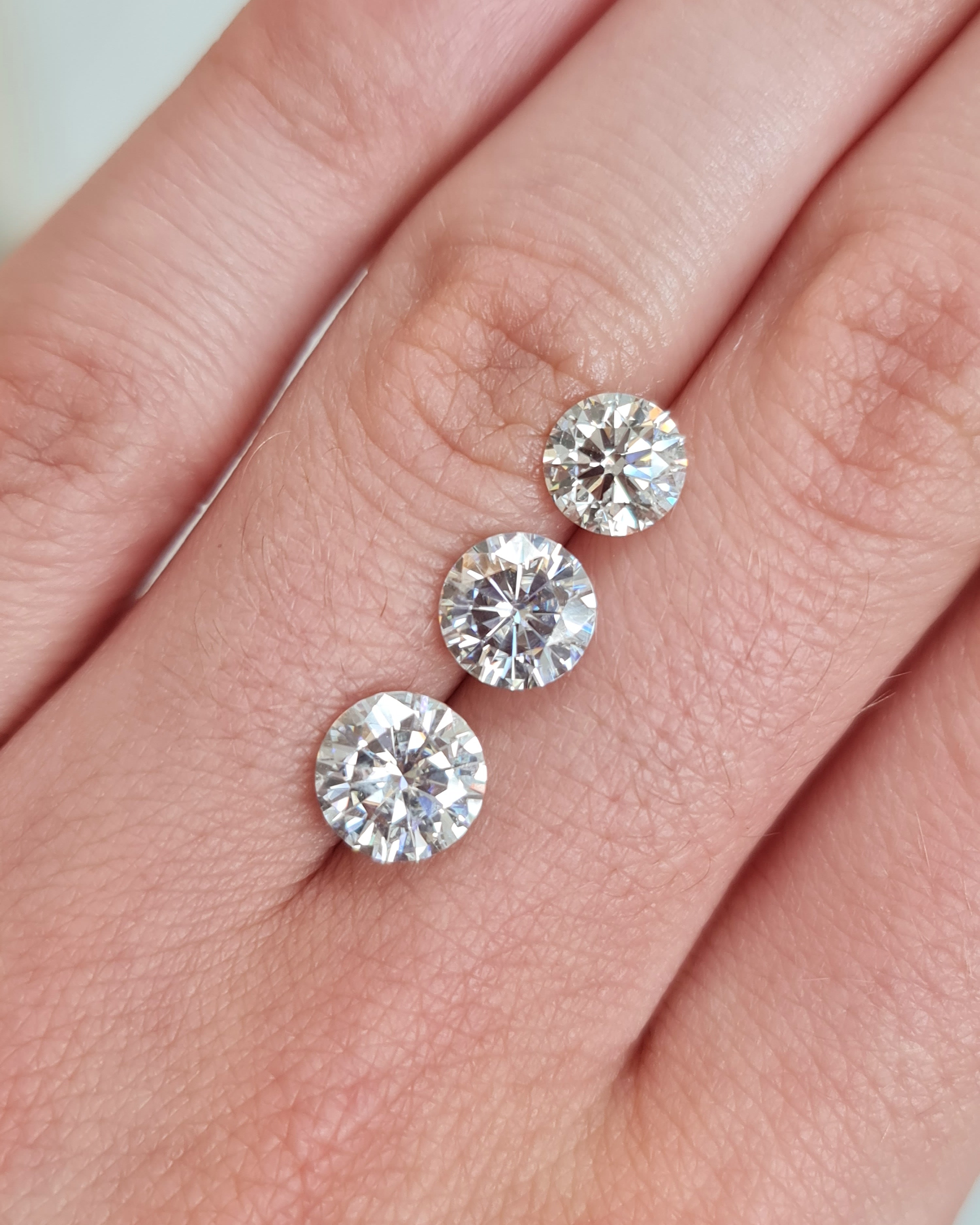 Three Round cut modern diamonds