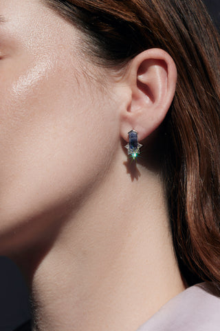 Layla Kaisi Wearing a Hexagonal Cut Sapphire Diamond Earring.