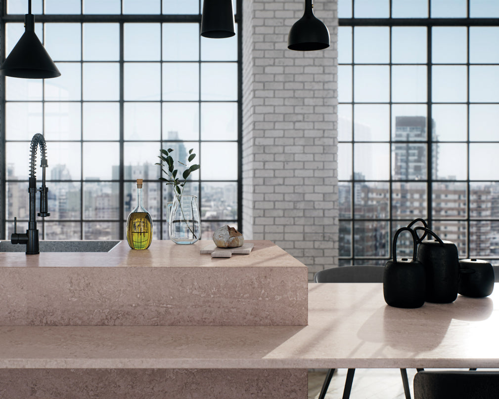 4023 Topus Concrete from Caesarstone's Metropolitan Collection forms the kitchen counter surfaces in this loft kitchen