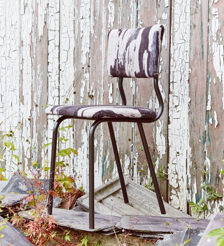 A classic industrial style chair is upholstered in fabric from Ruth Holly's SIGNATURE Monochrome collection