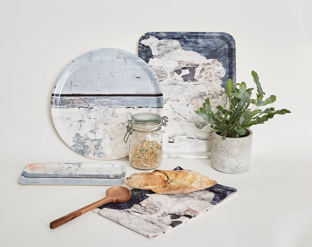 A selection of kitchen trays and a tea towel from Ruth Holly's Aspect collection