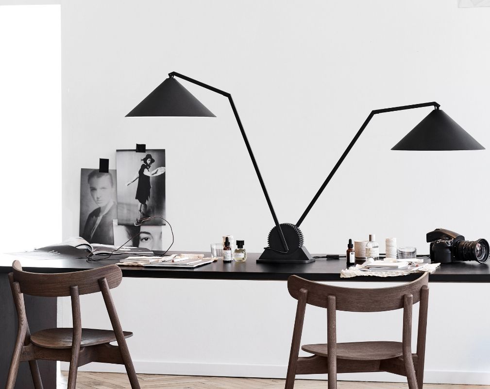 Gear double table lamp by Northern on a desk