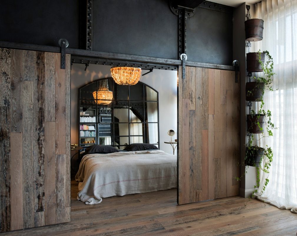 Bedroom behind industrial sliding doors featuring Havwoods Weathered Wood Rustic Surfaces