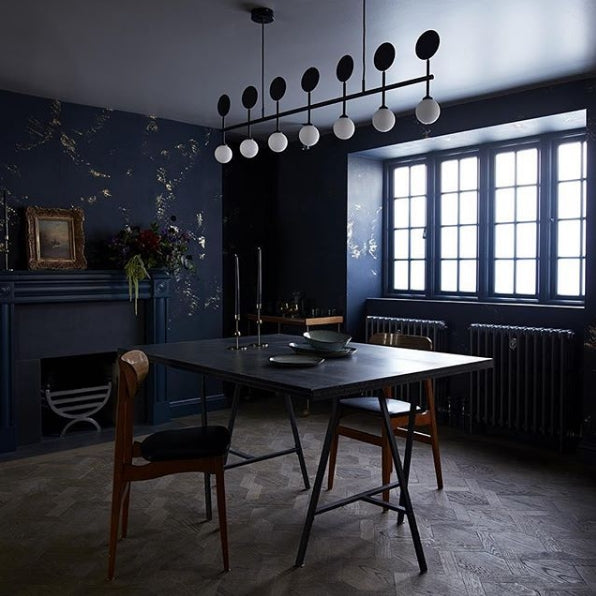 Igneous wallpaper in Navy by CUSTHOM featured in an industrial contemporary dining room
