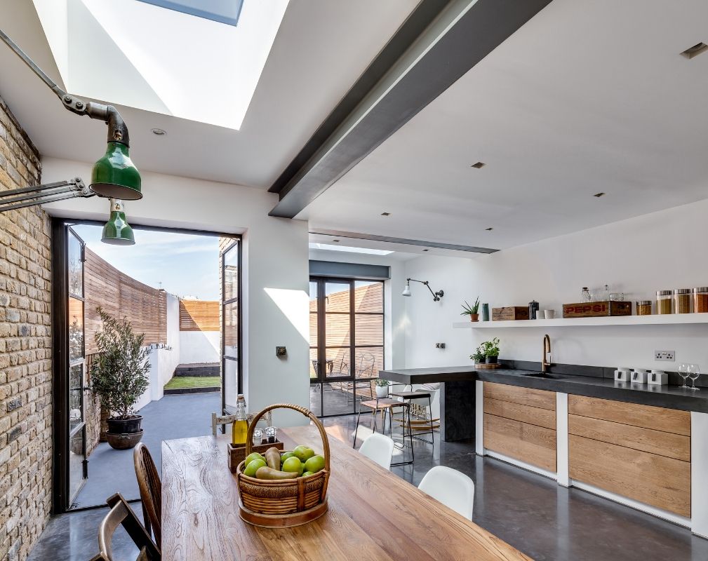 Open plan kitchen diner opens out onto the back garden with large Crittal Style doors and windows - Paper House Project