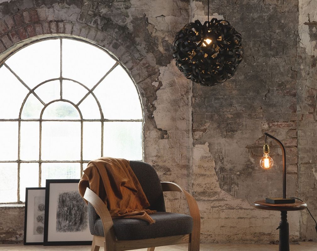 Tom Raffield Noctis No 1 Giant Pendant light set against an arched window and exposed brick wall