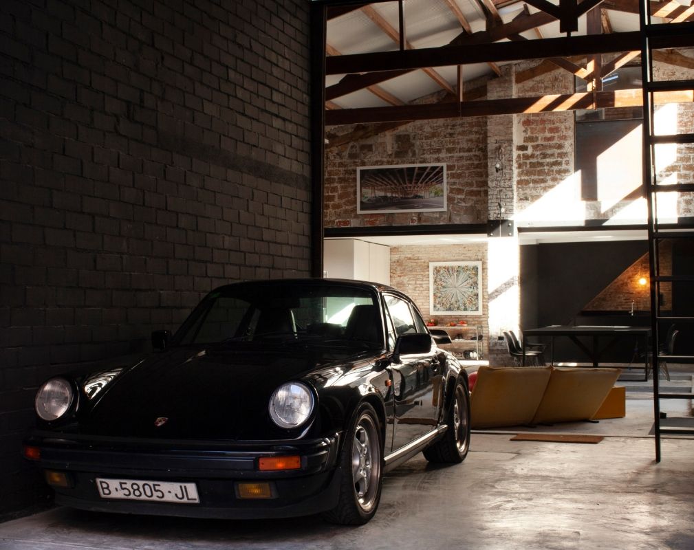 The Theatre warehouse conversion by Cadaval Sola-Morales. The access to the house is through a space reserved for a classic car. 