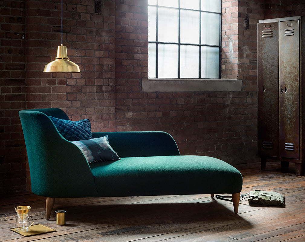 reading corner in luxe industrial interior scheme with brass factory style pendant light
