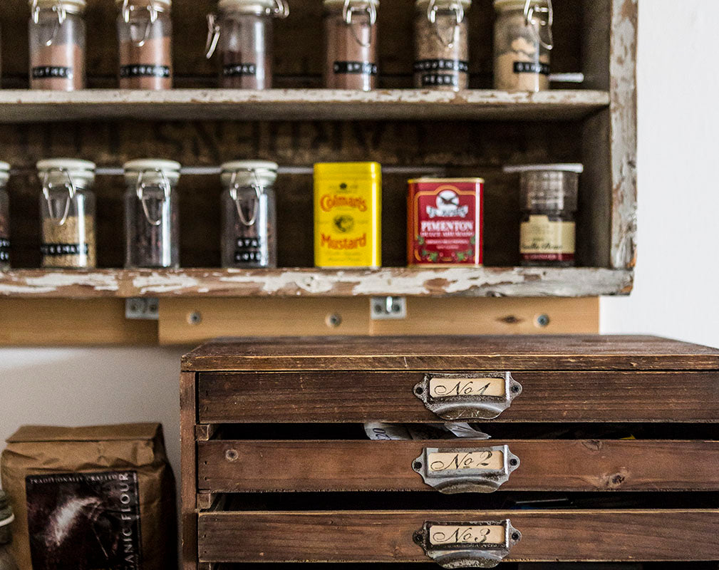 Vintage wooden drawers and spice rack.