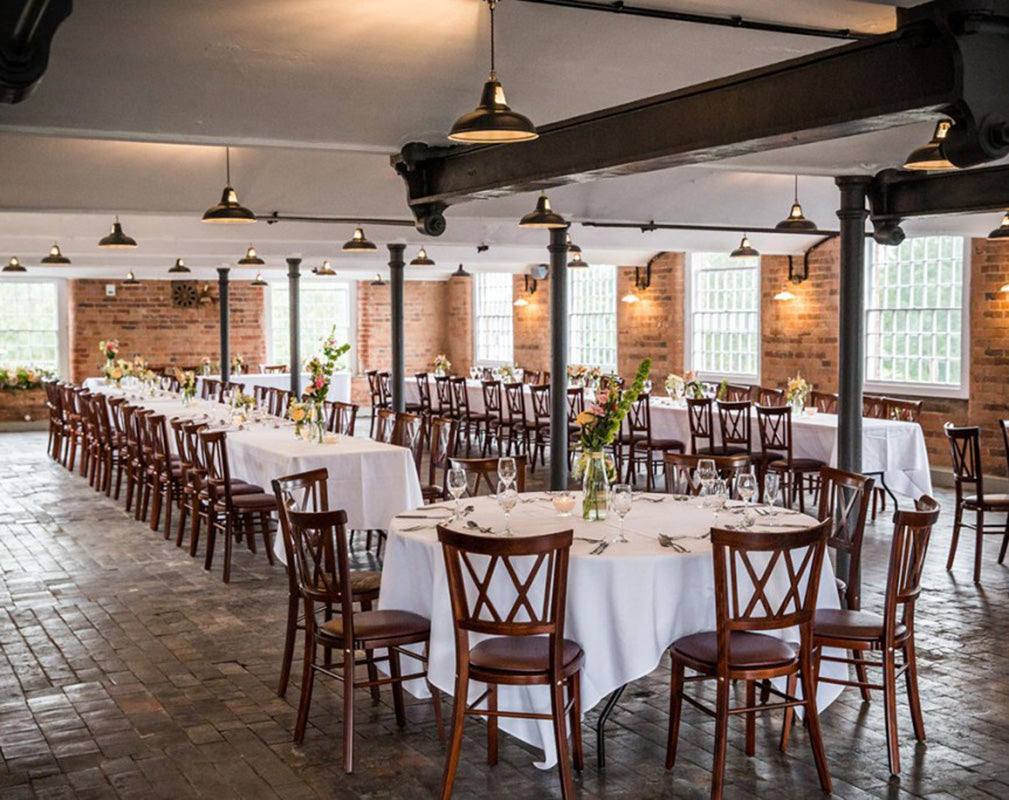 Impressive warehouse wedding venue styled by Artifact Lighting