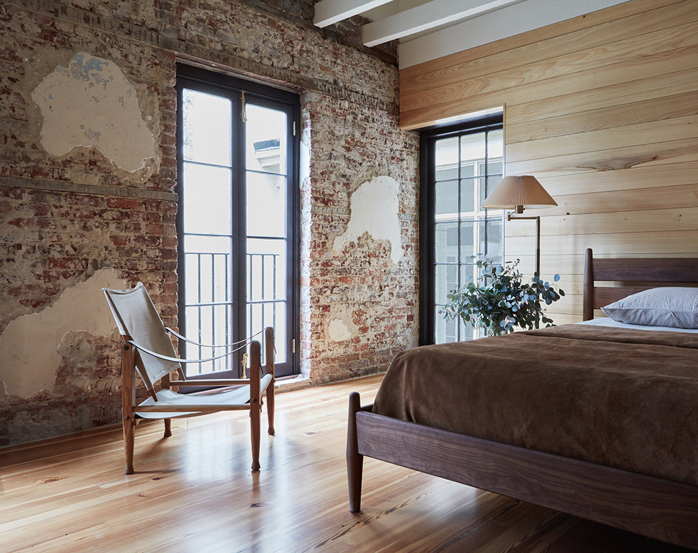original brickwork and raw plaster becomes a feature in this converted carriage house