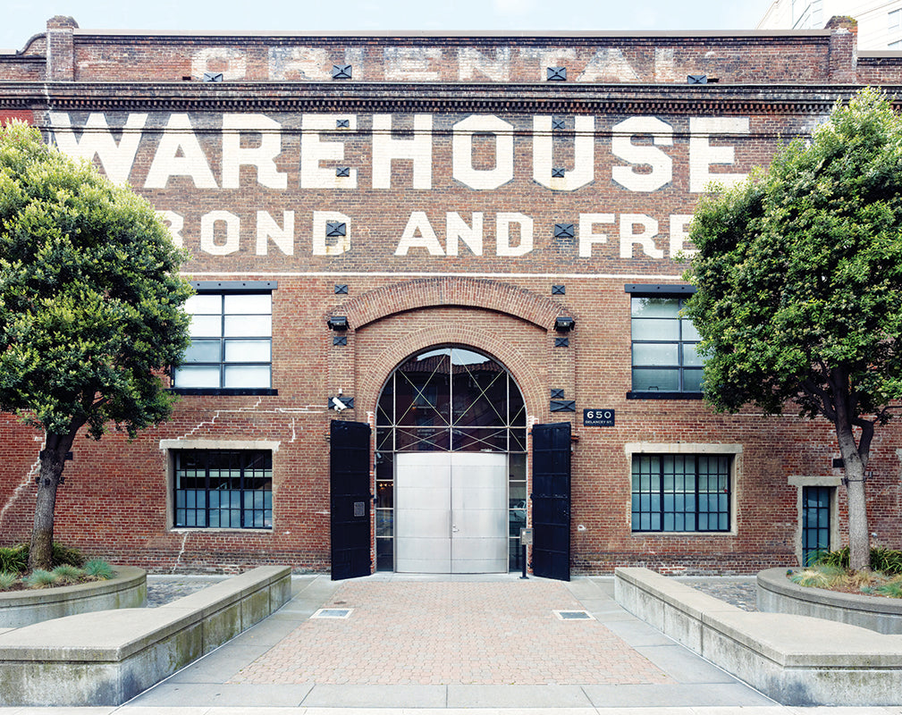 exterior of the oriental warehouse, san francisco featuring original brickwork and ghostsigns.