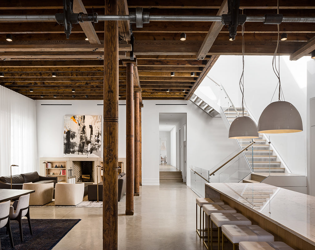 Contemporary furnishings offset original industrial features in this former propellor factory