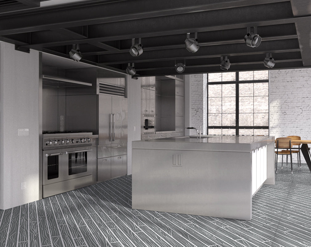 graphic wood grain floor tiles feature in this kitchen in a converted industrial building