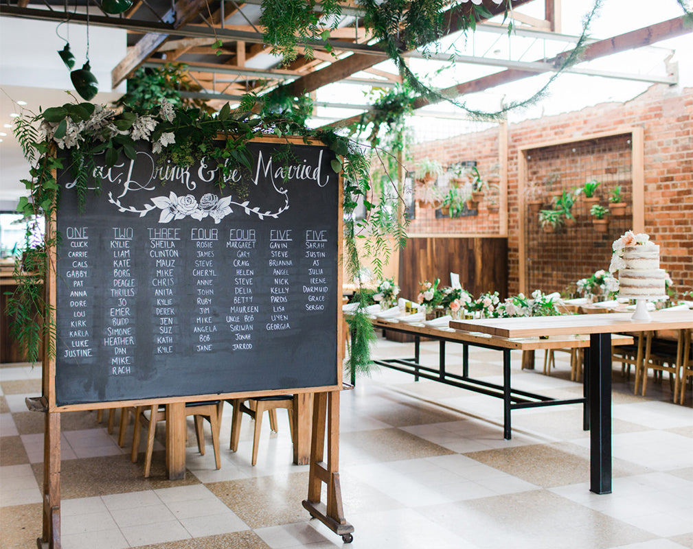 warehouse wedding venue in melbourne australia with exposed brick and hanging greenery