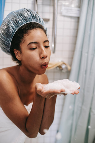 A woman using vitamin C face wash