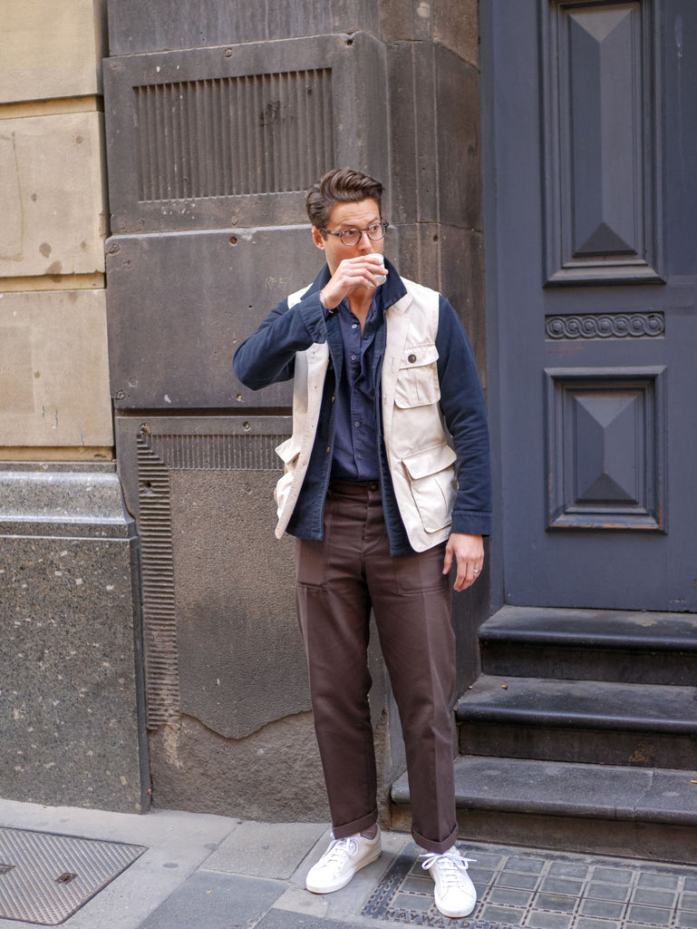 Beige_Utility_Vest_With_Ink_Work_Overshirt_and_Navy_Blue_Cotton_Linen_Shirt_Paired_With_Chocolate_Fatigue_Pants_and_Suede_Yogurt_White_Sneakers_51_Label