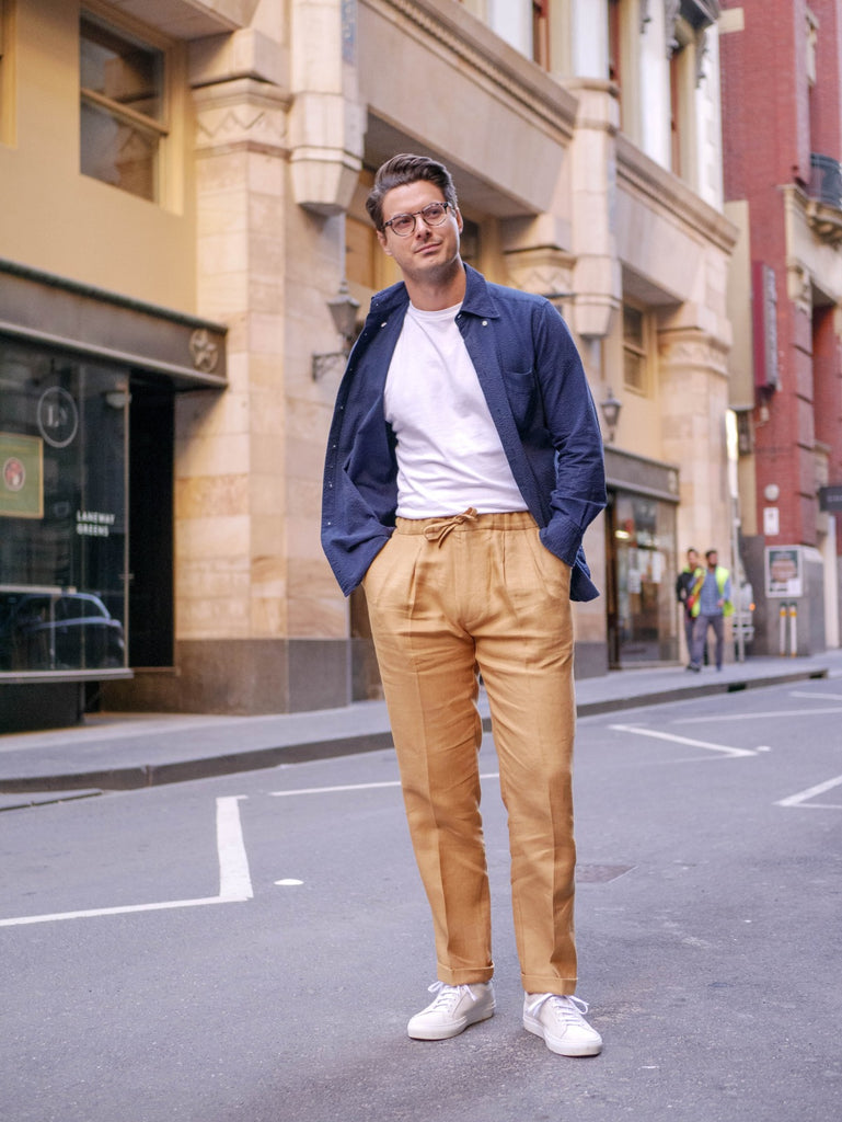 Navy_Blue_Seersucker_Over_Shirt_with_White_T-shirt_and_Caramel_Irish_Linen_Drawstring_Trousers_paired_with_Suede_Yogurt_White_Sneakers_51_Label