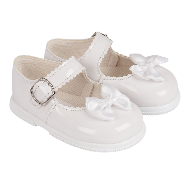 white hard sole baby shoes