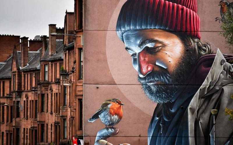 The mural depicts a modern-day St Mungo which references the story of the Bird That Never Flew.