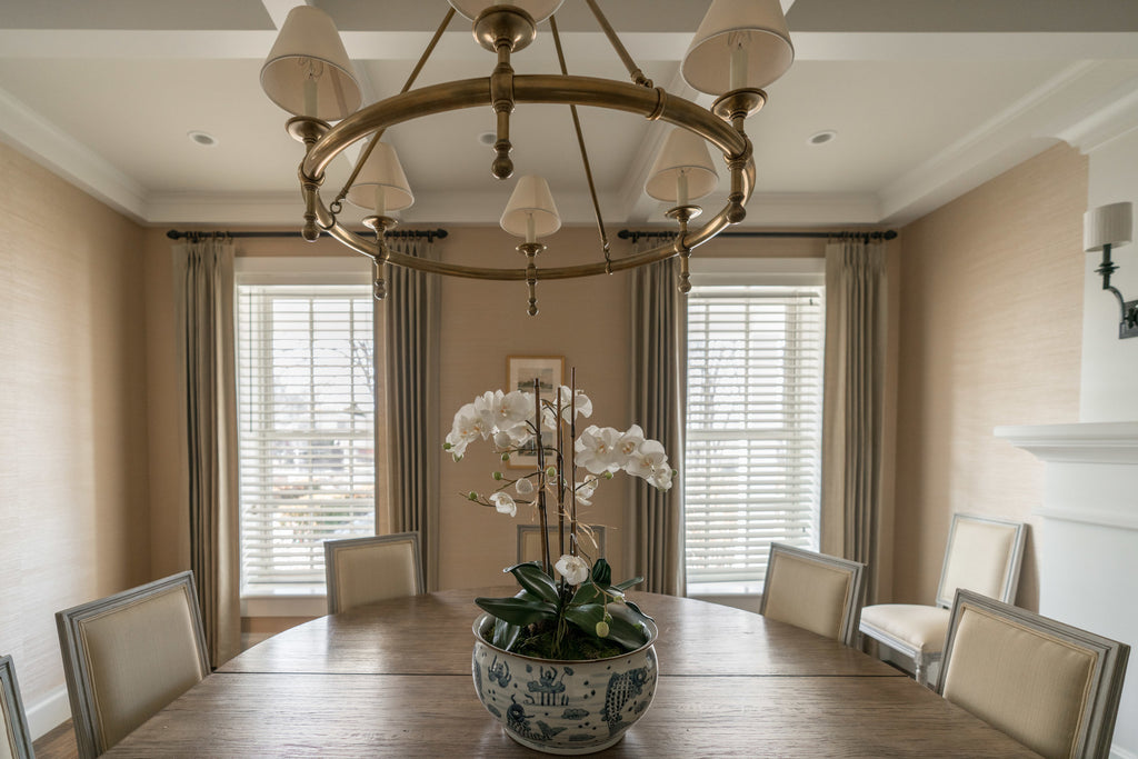 Plant on Dining Room Table With Electric Blinds in Background