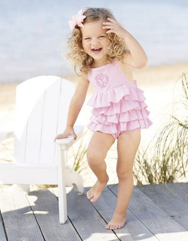 little girl in pink bathing suit