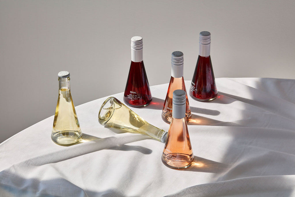 Assortment of Usual Wines on white tablecloth