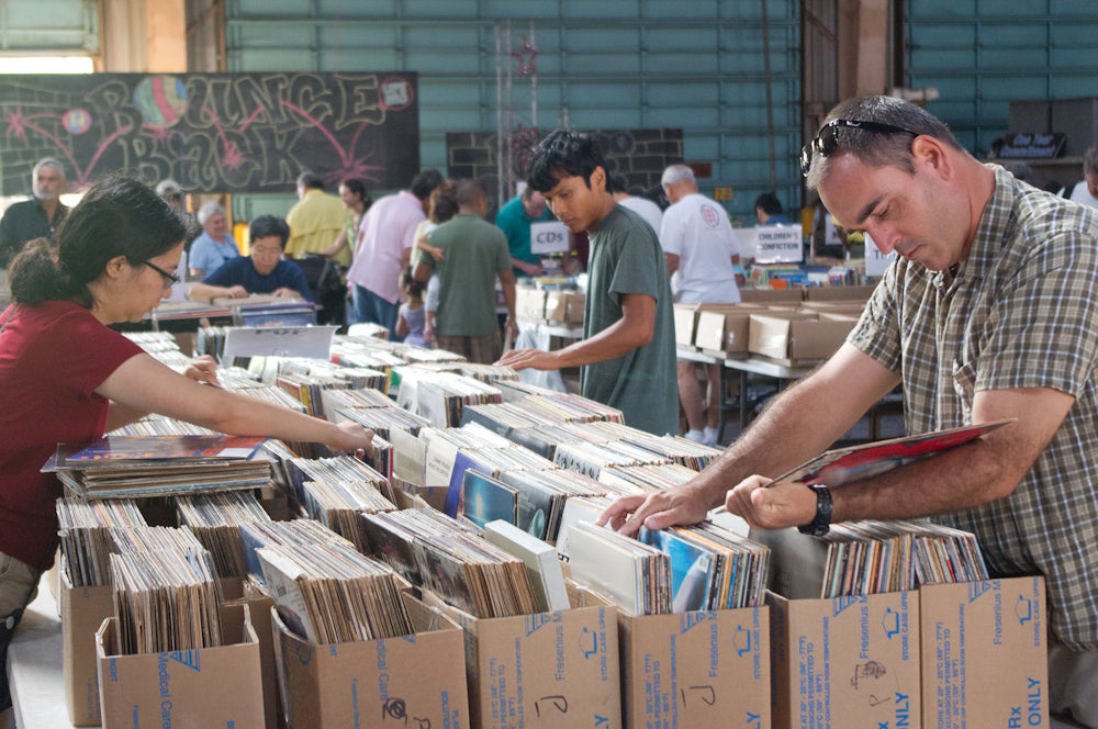 Collectors look through the Pop section. 