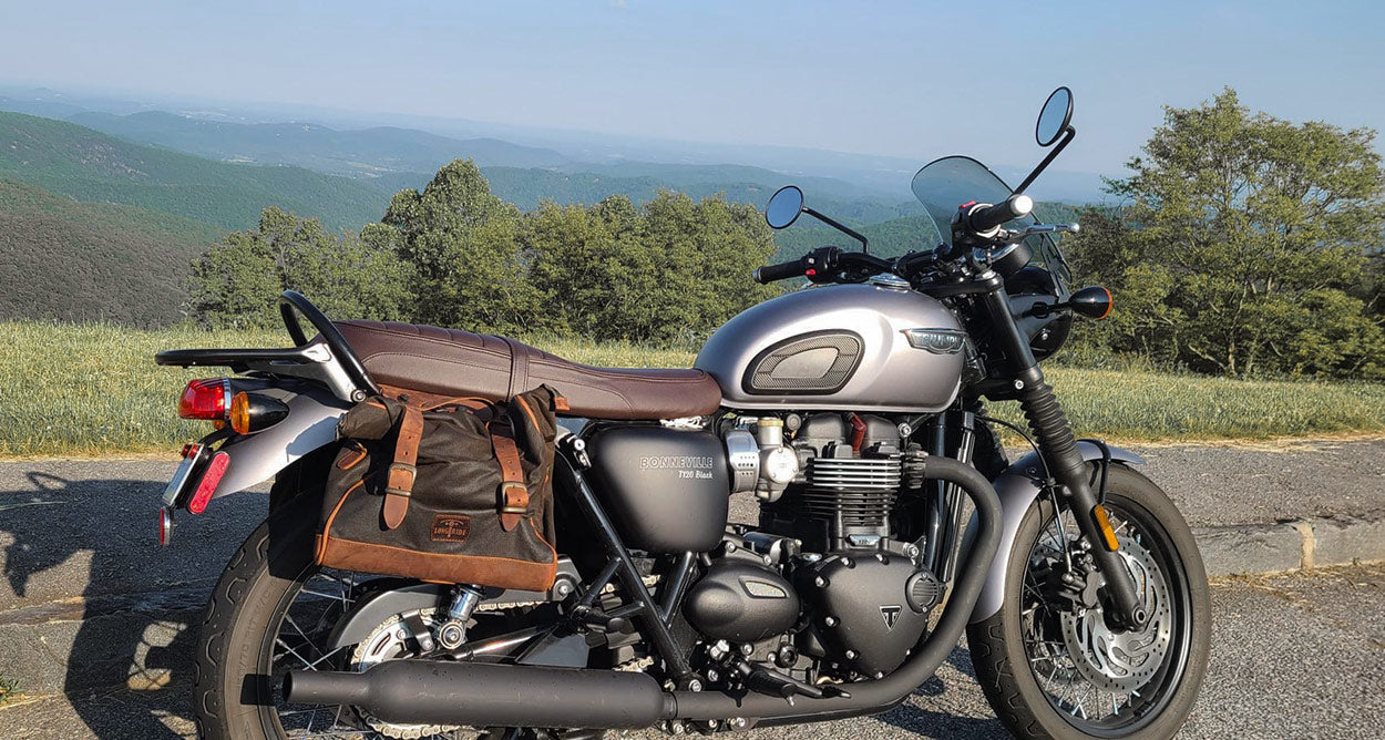 Vintage saddlebag on T120 Black Bonneville moto.