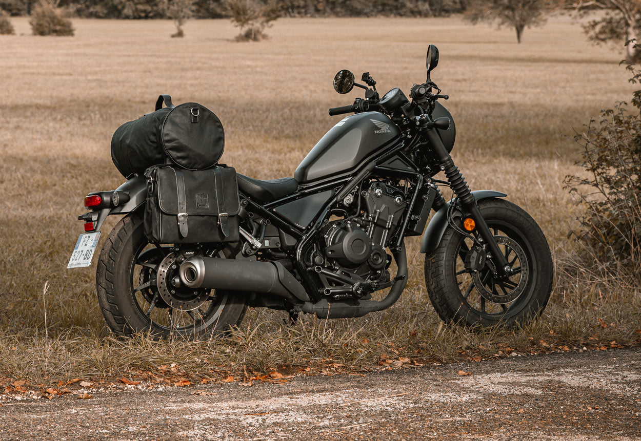 Motorcycle black waterproof pannier for Honda Rebel.