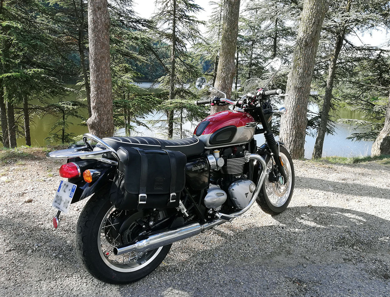 Cranberry red and aluminium Troumph Bonneville with saddlebags.