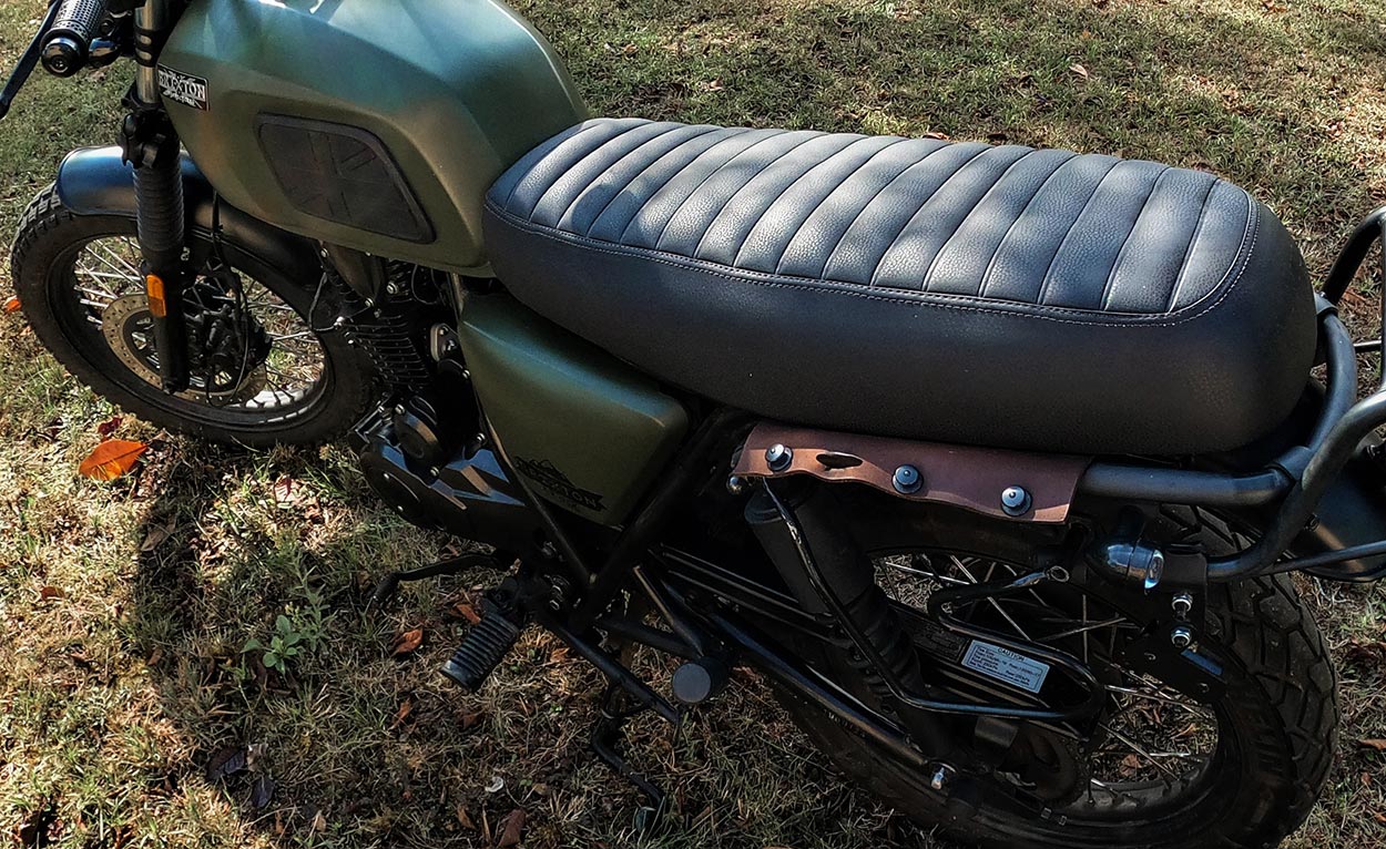Quick-release leather system for scrambler saddlebags.