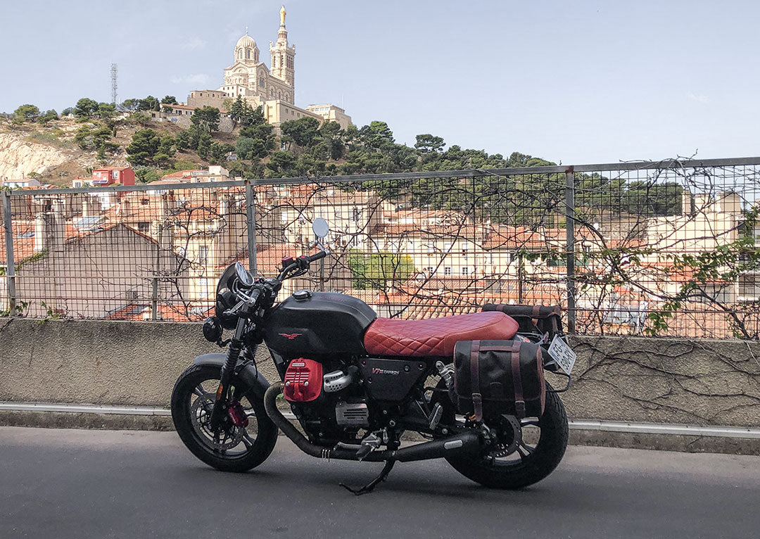 Moto Guzzi Carbon Red with saddlebags.