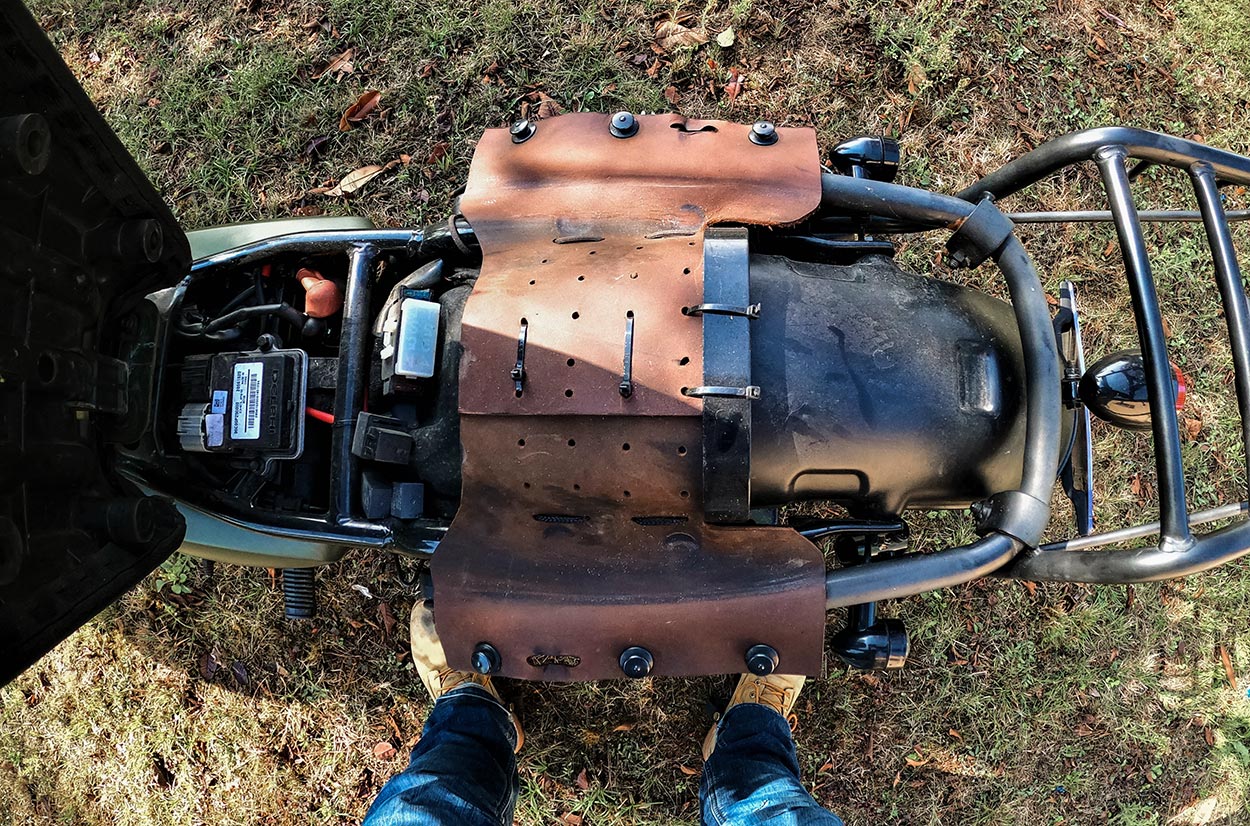 Quick release system for saddlebags on scrambler motorcycle.