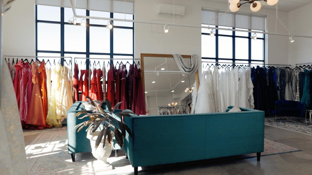 An inside shot of our store showing racks of dresses